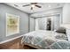 Comfortable bedroom with hardwood floor, walk in closet, and ceiling fan at 3197 Church St, Atlanta, GA 30344
