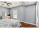 Comfortable bedroom with hardwood flooring, ceiling fan and a dresser at 3197 Church St, Atlanta, GA 30344