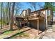 Backyard with wooden decks, screened-in porch, and stairs at 3292 Holly Mill Ct, Marietta, GA 30062