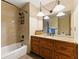 Well-lit bathroom featuring a tub-shower combination and granite vanity at 3292 Holly Mill Ct, Marietta, GA 30062