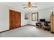 Cozy bedroom with neutral carpet, ceiling fan, and closet at 3292 Holly Mill Ct, Marietta, GA 30062