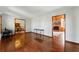 Spacious living room featuring hardwood floors, stone fireplace and dining room at 3292 Holly Mill Ct, Marietta, GA 30062