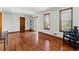 Bright living room with hardwood floors, white walls and large windows at 3292 Holly Mill Ct, Marietta, GA 30062