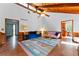 Bright living room with hardwood floors, vaulted wood ceilings, and contemporary furnishings at 3292 Holly Mill Ct, Marietta, GA 30062