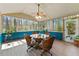 Enclosed sunroom with light wood floors, white ceilings, and outdoor views at 3292 Holly Mill Ct, Marietta, GA 30062