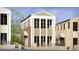 Beautifully designed three-story building with a covered entry and symmetrical facade at 235 Rolison Way, Fayetteville, GA 30214