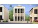Striking three-story home showcasing a modern design and elegant architectural details at 235 Rolison Way, Fayetteville, GA 30214