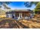 The backyard boasts a spacious screened porch perfect for entertaining and relaxing at 409 Hunting Ridge Way, Ellenwood, GA 30294