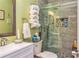 Modern bathroom with a glass-enclosed shower, sleek vanity, and stylish tiled accents at 409 Hunting Ridge Way, Ellenwood, GA 30294