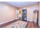 Bedroom with dark wood floors and an adjacent room at 409 Hunting Ridge Way, Ellenwood, GA 30294