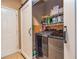 Well-organized laundry room with modern washer and dryer, shelving, and a convenient sliding barn door at 409 Hunting Ridge Way, Ellenwood, GA 30294