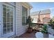 View of a cozy outdoor patio with table and chairs, overlooking a neighboring home at 4406 Kendall Way, Roswell, GA 30075
