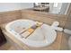 Relaxing bathtub with tile surround, and spa jets at 4406 Kendall Way, Roswell, GA 30075