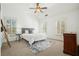 Bright bedroom with vaulted ceilings, plantation shutters, and plush carpeting offers a serene escape at 4406 Kendall Way, Roswell, GA 30075