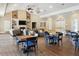 Spacious clubhouse with hardwood floors, a fireplace, comfortable seating, and plenty of tables at 4406 Kendall Way, Roswell, GA 30075