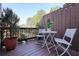 Outdoor deck area perfect for entertaining with potted plants and white furniture at 4406 Kendall Way, Roswell, GA 30075