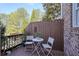 Outdoor deck area perfect for entertaining with potted plants and white furniture at 4406 Kendall Way, Roswell, GA 30075