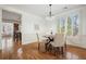 Charming dining room with hardwood floors, stylish chairs, and elegant lighting fixture at 4406 Kendall Way, Roswell, GA 30075