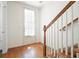 Entryway showcasing beautiful hardwood floors and a staircase at 4406 Kendall Way, Roswell, GA 30075