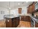Spacious kitchen boasts a large island, stainless steel appliances, and ample cabinet space for all your culinary needs at 4406 Kendall Way, Roswell, GA 30075