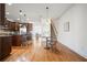 Well-lit kitchen with an adjacent dining area is equipped with a large island and modern appliances at 4406 Kendall Way, Roswell, GA 30075