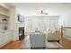 Bright living room with hardwood floors, fireplace, built-in shelves, neutral furniture, and natural light at 4406 Kendall Way, Roswell, GA 30075