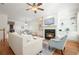 Cozy living room showcases hardwood flooring, a fireplace, built-in shelving, and neutral decor at 4406 Kendall Way, Roswell, GA 30075