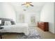Well-lit main bedroom featuring plantation shutters, a plush rug, and an inviting atmosphere at 4406 Kendall Way, Roswell, GA 30075