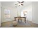 Well-lit office with windows, natural light, rug, and a chair for work or study at 4406 Kendall Way, Roswell, GA 30075