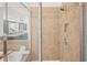 Shower featuring a glass door, tiled walls, and a niche for storage at 4406 Kendall Way, Roswell, GA 30075