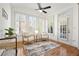 Sunroom with an abundance of natural light, plantation shutters, and elegant furnishings offers a relaxing space at 4406 Kendall Way, Roswell, GA 30075