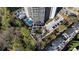 An aerial view showcasing the building's pool, amenities and surrounding landscape at 2660 Peachtree Nw Rd # 26F, Atlanta, GA 30305