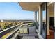 Inviting balcony with cushioned seating, a table, and panoramic city views at 2660 Peachtree Nw Rd # 26F, Atlanta, GA 30305