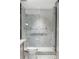 Contemporary bathroom with a glass-enclosed shower and a marble tiled backsplash at 2660 Peachtree Nw Rd # 26F, Atlanta, GA 30305