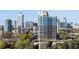 Stunning city view showing high-rise buildings and lush trees on a sunny day at 2660 Peachtree Nw Rd # 26F, Atlanta, GA 30305