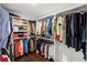 Spacious walk-in closet with custom shelving and ample storage for clothes and accessories at 2660 Peachtree Nw Rd # 26F, Atlanta, GA 30305