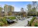 Inviting courtyard with fire pit, comfortable seating, and lush landscaping for outdoor relaxation at 2660 Peachtree Nw Rd # 26F, Atlanta, GA 30305
