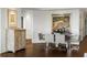Elegant dining room with modern table, chairs, and hardwood floors at 2660 Peachtree Nw Rd # 26F, Atlanta, GA 30305