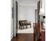 Chic hallway with dark wood floors, paneled walls, and stylish decor at 2660 Peachtree Nw Rd # 26F, Atlanta, GA 30305