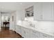 Bright kitchen featuring white cabinets, stainless steel appliances, and marble countertops at 2660 Peachtree Nw Rd # 26F, Atlanta, GA 30305