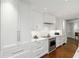 Modern kitchen featuring white cabinets, stainless steel appliances, and beautiful marble countertops at 2660 Peachtree Nw Rd # 26F, Atlanta, GA 30305