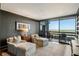 Stylish living room with seating, a wooden floor, and a picturesque balcony view at 2660 Peachtree Nw Rd # 26F, Atlanta, GA 30305