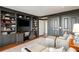 Stylish living room with custom built-ins, providing both functionality and a touch of elegance for comfortable living at 2660 Peachtree Nw Rd # 26F, Atlanta, GA 30305