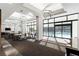 Elegant lounge area with floor-to-ceiling windows overlooking the pool at 2660 Peachtree Nw Rd # 26F, Atlanta, GA 30305