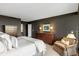 Comfortable main bedroom with dark colored walls, a dresser, and a soft seat at 2660 Peachtree Nw Rd # 26F, Atlanta, GA 30305