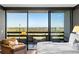 Cozy main bedroom with city views and sliding glass door to outdoor seating area at 2660 Peachtree Nw Rd # 26F, Atlanta, GA 30305