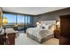 Luxurious main bedroom featuring a large window offering expansive city views at 2660 Peachtree Nw Rd # 26F, Atlanta, GA 30305