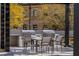 An outdoor grilling area features stainless steel grills and a dining table for entertaining at 2660 Peachtree Nw Rd # 26F, Atlanta, GA 30305