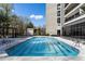 Swimming pool with lounge chairs for relaxation under the sun at 2660 Peachtree Nw Rd # 26F, Atlanta, GA 30305