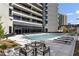 An inviting swimming pool and patio area provides a perfect outdoor retreat at 2660 Peachtree Nw Rd # 26F, Atlanta, GA 30305